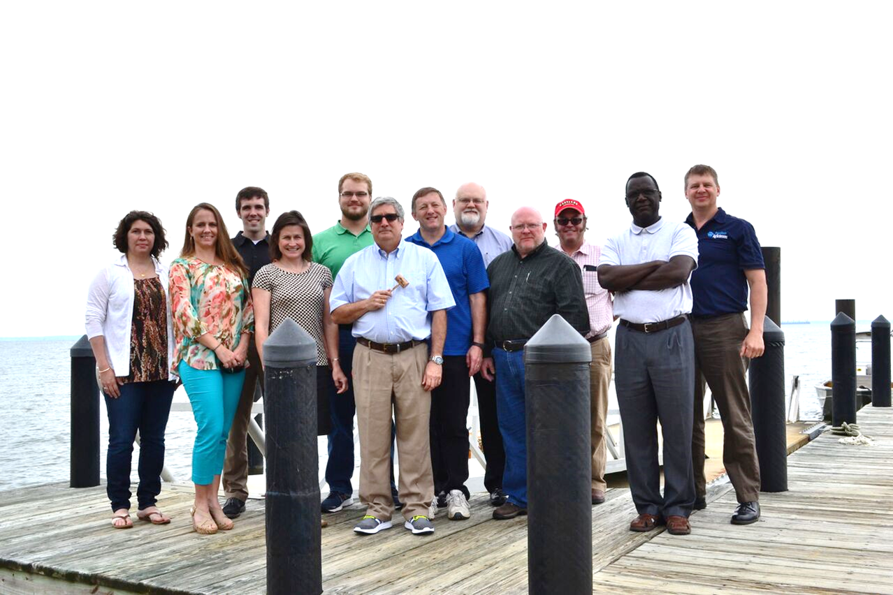 The panel standing on the dock of the Chesapeake Bay