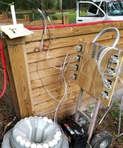 Figure 3. Arrangement of the eight peristaltic pumps on a hand truck dolly for ease of transport. The pumps with connected clear silicone tubing are attached to the lysimeter collection line for leachate collection. 