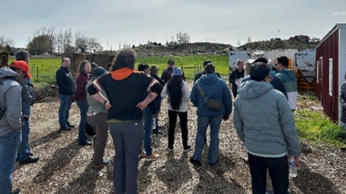 tour participants on a farm