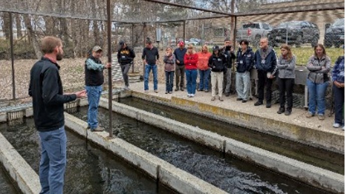 Tour participants at a fish hatchery.